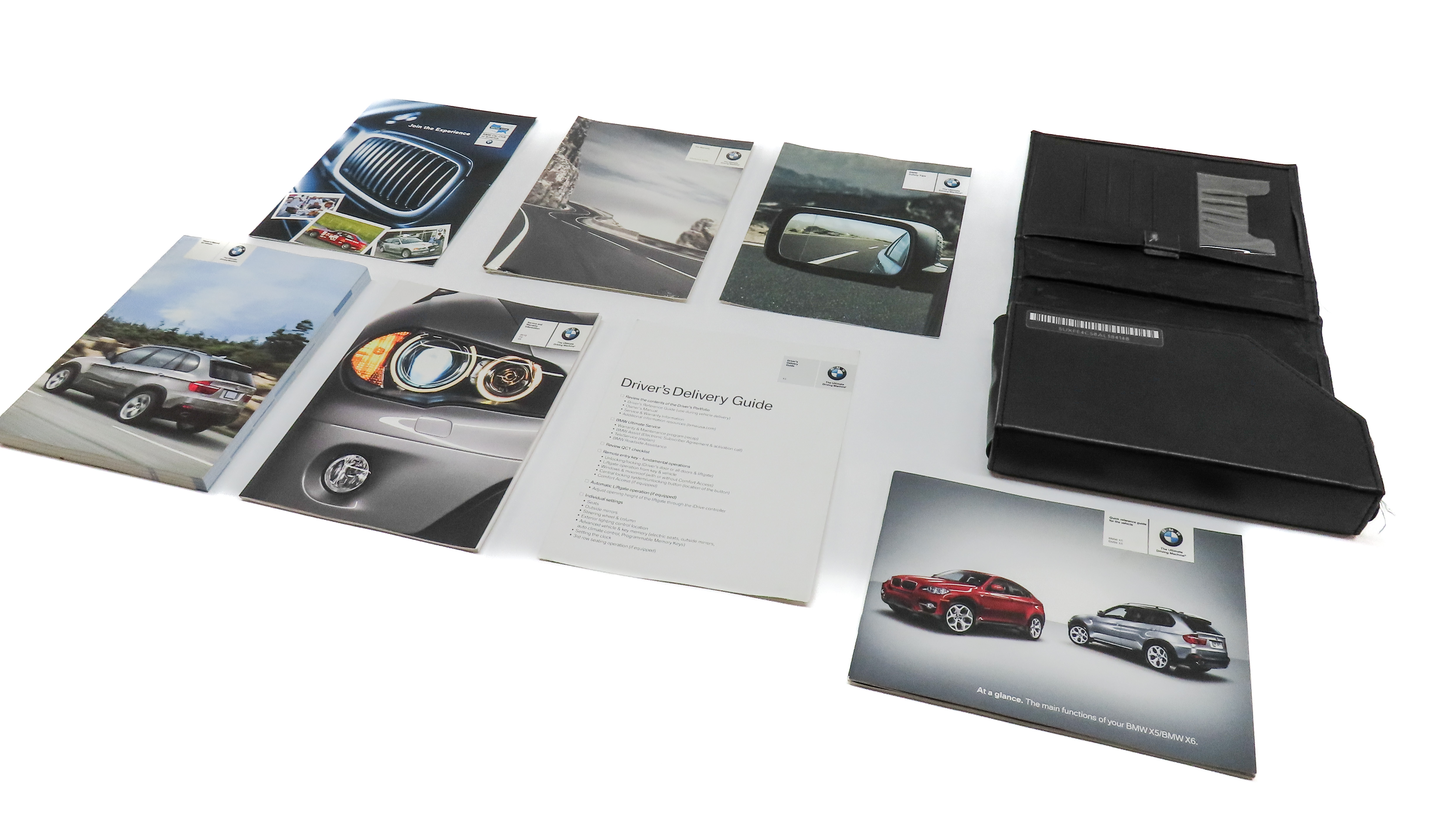 2010 BMW X5 (E70) OWNERS MANUAL BOOKLET SET 7 w/ CARRYING CARRY CASE — exact item pictured